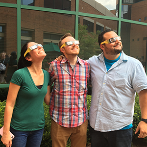 Employees viewing solar eclipse